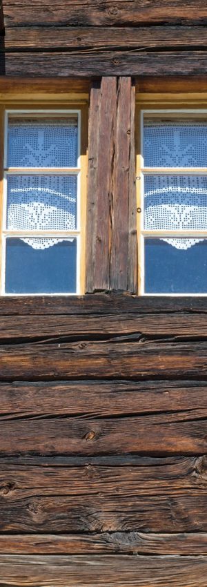 Two windows of a wooden hut